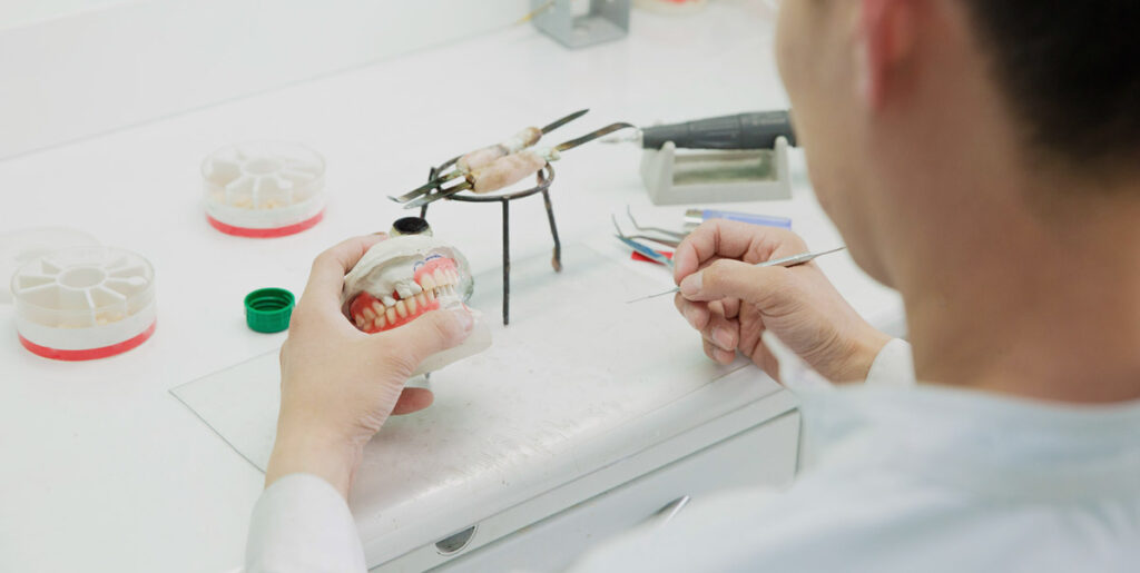 man making dentures