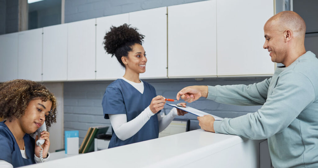 dentists reception man addressing affordability