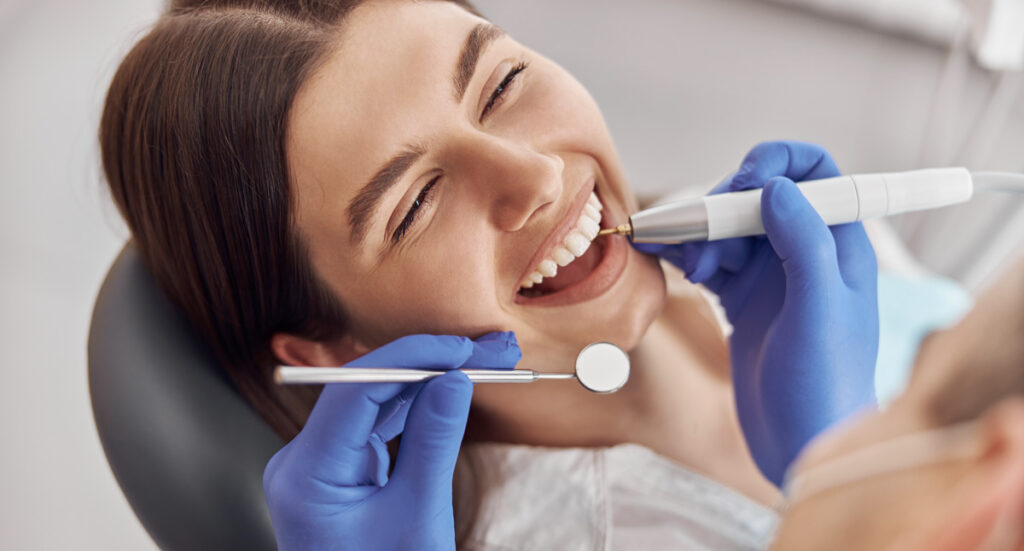 woman at dentists suitable candidate for composite teeth bonding