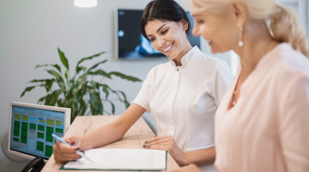 woman dental reception dental finance communication