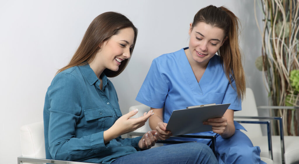 woman at dental reception affordable payment plans
