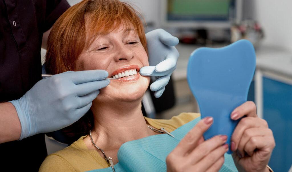 woman at dentists dental implants surgery explained