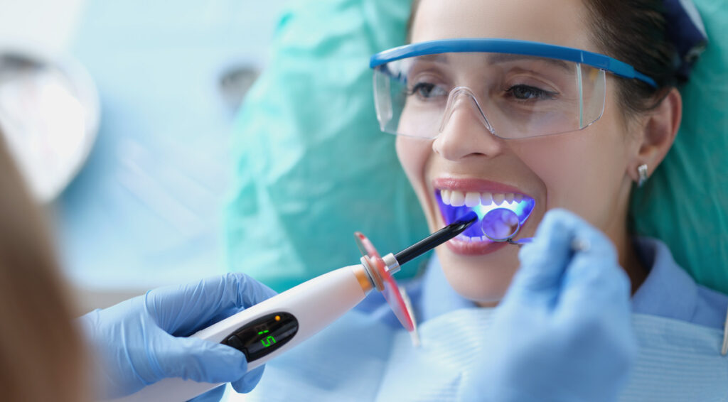 woman at dentists for composite bonding procedure teeth bonding